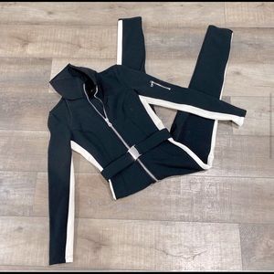 Stunning Cordova ski suit. Size medium. Black & white new w/ all tags attached.